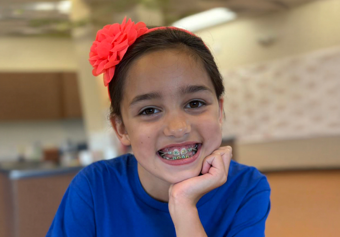 A Young Girl Who Is A Dr Mcsurdy Staff Patient Smiling