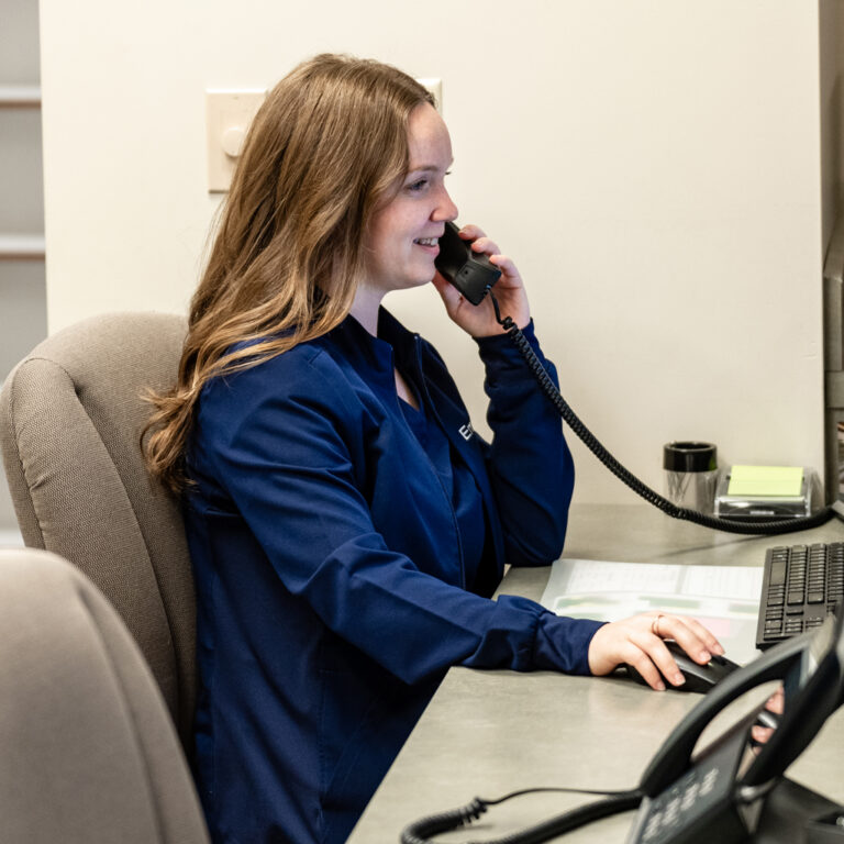 Close Up Of Receptionist Answering Phone 1