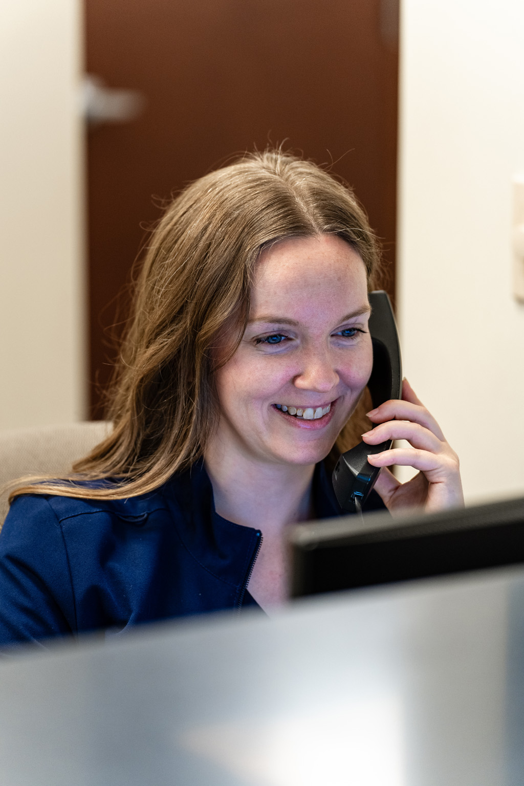 Close Up Of Receptionist On The Phone