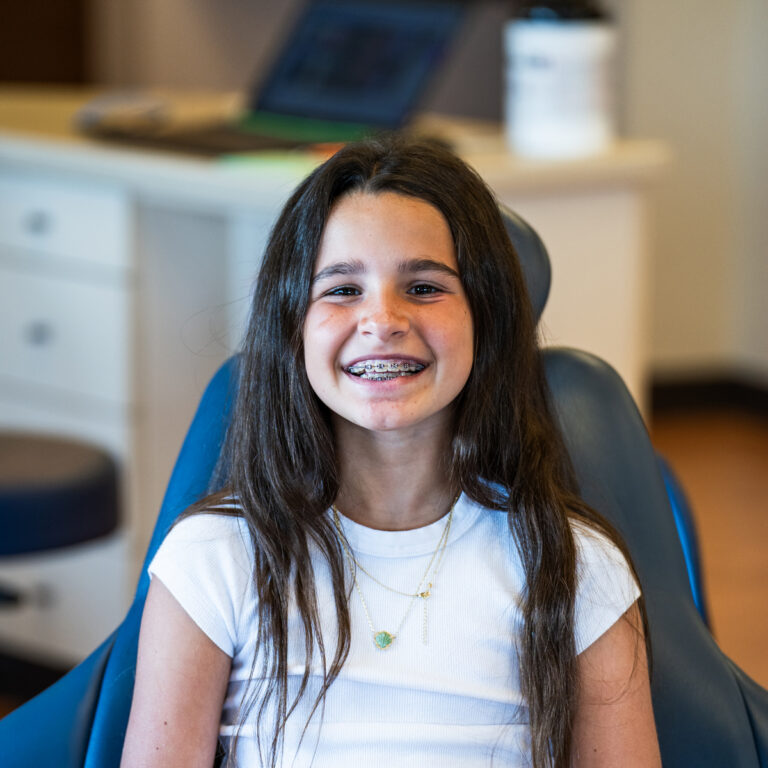 Happy Female Child Patient Wearing Braces 1
