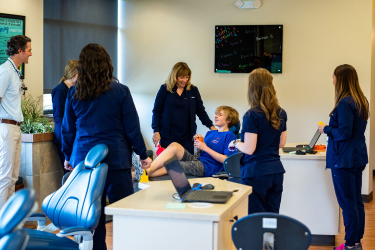 Smiling Group Of Patients And Technicians